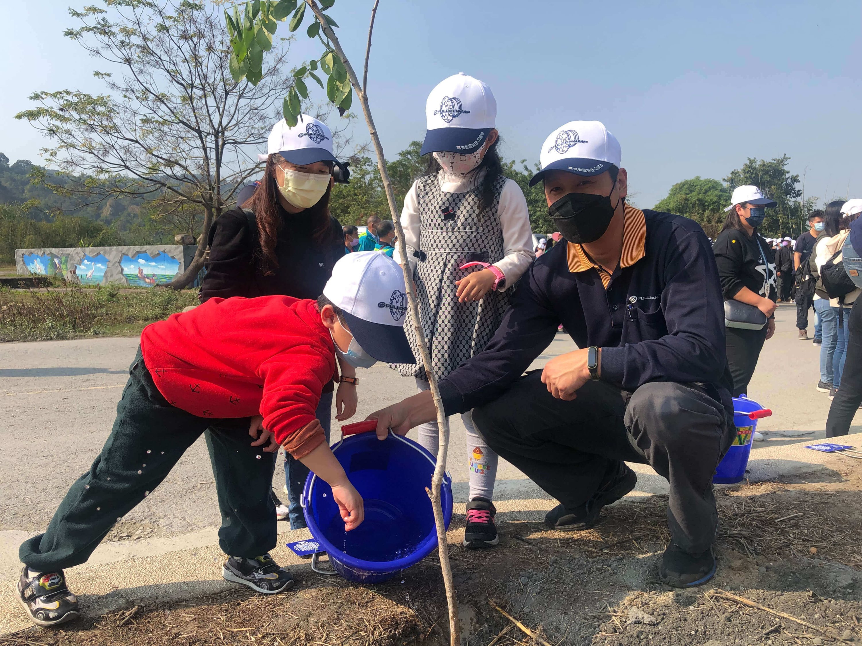 a family in Taiwan planting a tree